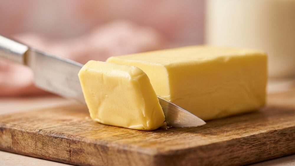 Butter stick being sliced